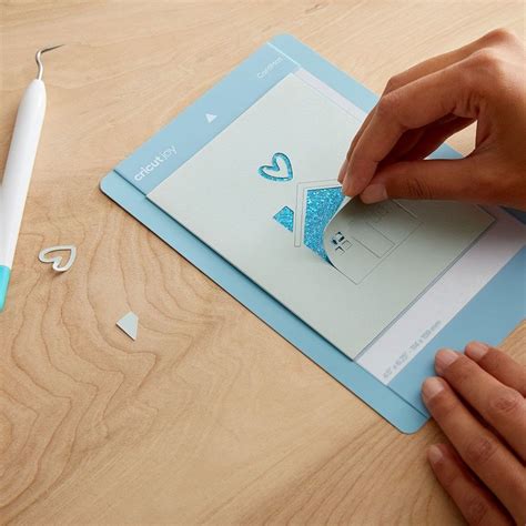 2008858 - Cricut Joy Cut Away Card Corsage Sampler; 8 cards with adhesive (3 Deep Teal, 2 Tulip, 3 Wild Aster); 8 Gold Matte Crystal backers; 8 White envelopes; Dimensions: Cards 4.25 in x 5.5 in (10.8 cm x 14 cm), Backers 4.1 in x 5.3 in (10.4 cm x 13.6 cm), Envelopes 4.37 in x 5.75 in (11 cm x 14.6 cm); Create stunning custom cards in minutes; Easy to cut with specialized Cricut Joy™ Card Mat (sold separately); For Cricut Joy™